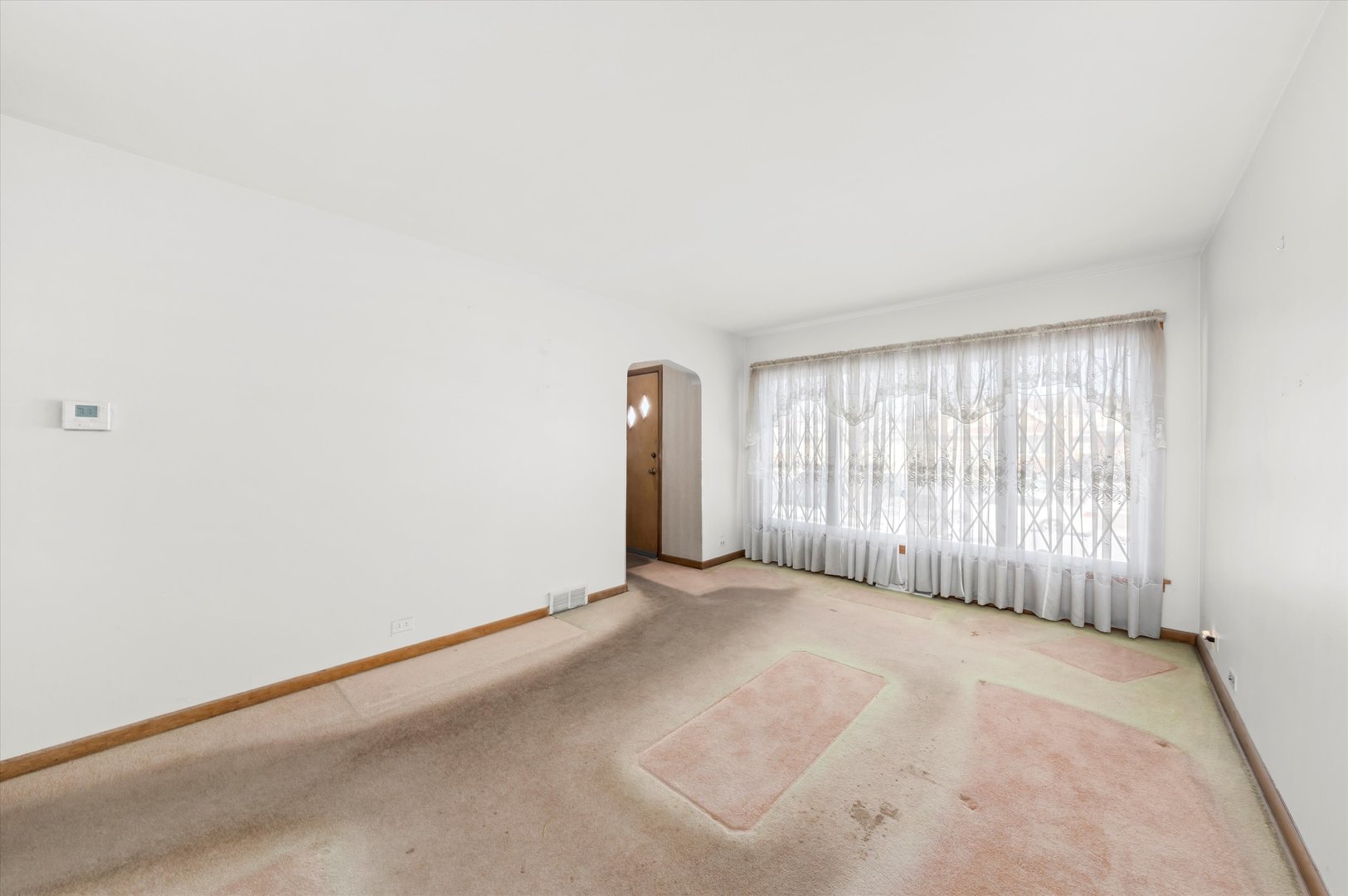 6511 West 63rd Place Chicago, IL 60638 - Photo 6 of 12 a view of an empty room with a window