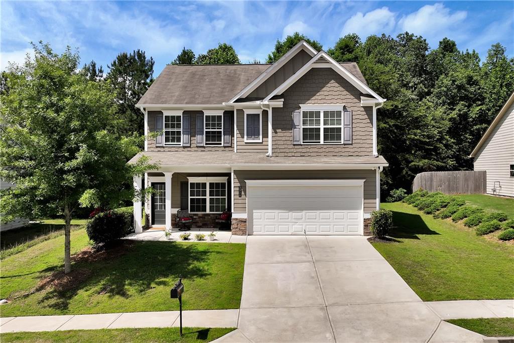 3920 Overlook Ridge Lane Gainesville, GA 30507 - Photo 1 of 1 a front view of a house with a yard and potted plants