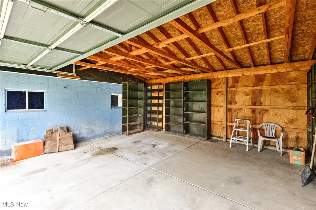 7529 State Line Burghill, OH 44404 - Photo 22 of 23 Garage with concrete block wall