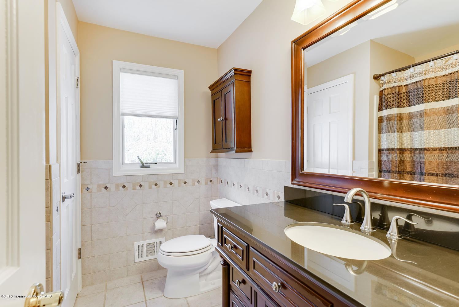 370 Cook Road Jackson, NJ 08527 - Photo 19 of 35 a bathroom with a granite countertop sink and a mirror