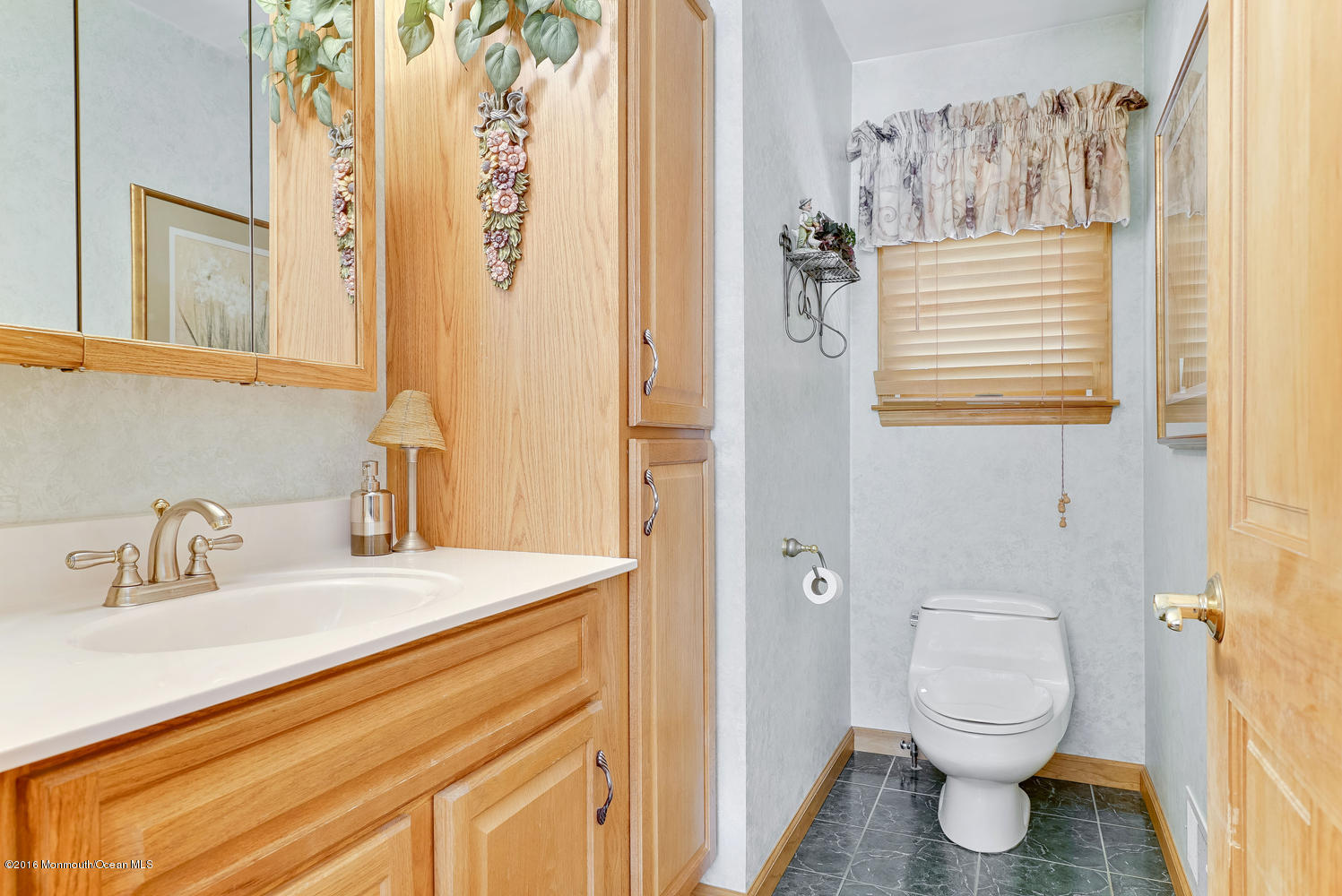 370 Cook Road Jackson, NJ 08527 - Photo 20 of 35 a bathroom with a sink a toilet and a mirror