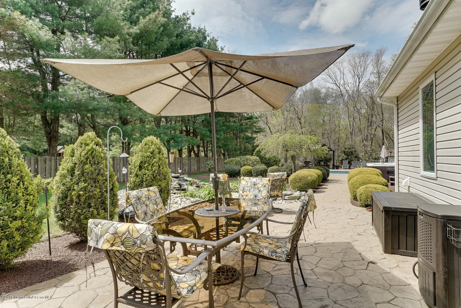 370 Cook Road Jackson, NJ 08527 - Photo 26 of 35 a patio with a yard table and chairs