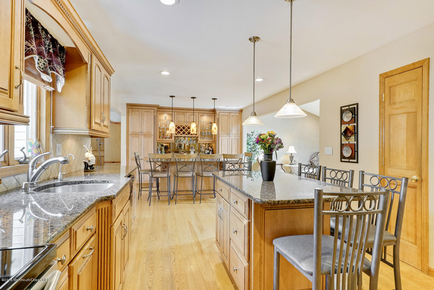 370 Cook Road Jackson, NJ 08527 - Photo 6 of 35 a view of a dining room and livingroom with furniture wooden floor a chandelier