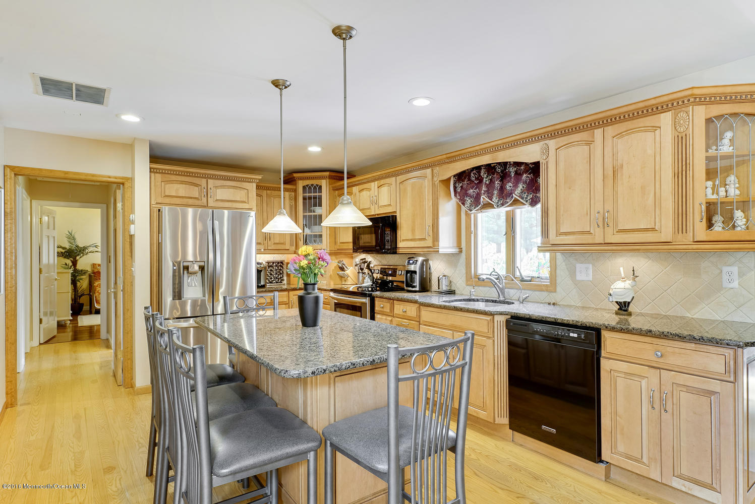 370 Cook Road Jackson, NJ 08527 - Photo 9 of 35 a kitchen with granite countertop a sink appliances cabinets and dining table