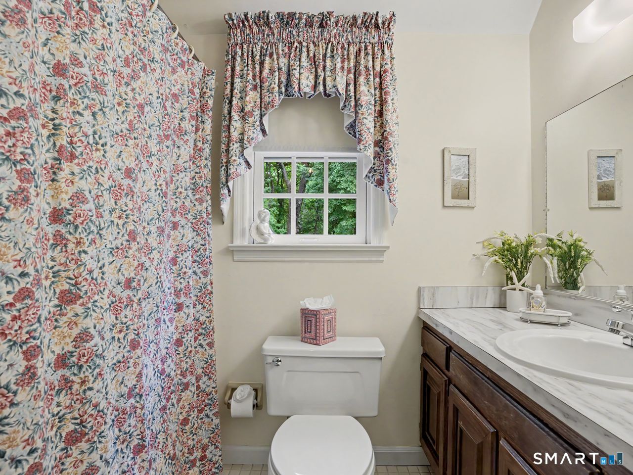 86 Fire Hill Road Redding, CT 06896 - Photo 29 of 36 a bathroom with a granite countertop toilet a sink and a window