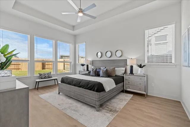 a spacious bedroom with a large bed and a window