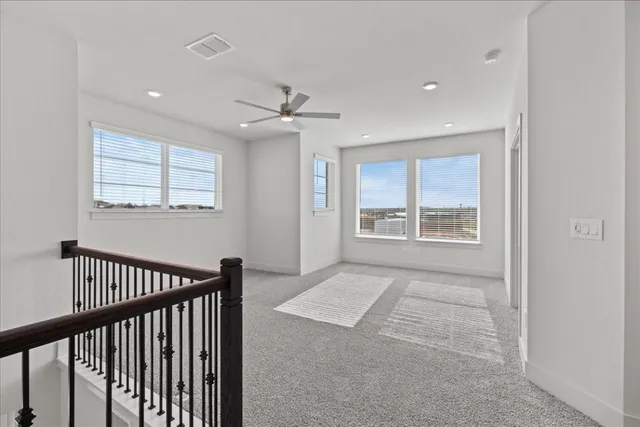 a view of hallway with windows