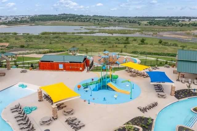 an aerial view of a house with a swimming pool