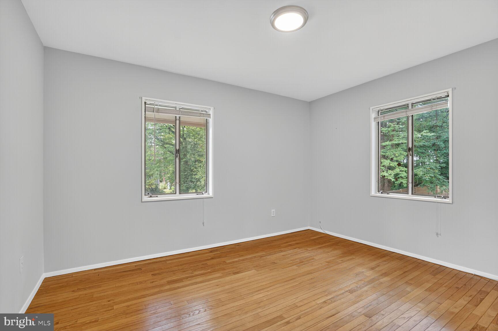 7319 Leesville Boulevard Springfield, VA 22151 - Photo 12 of 18 a view of empty room with wooden floor and fan