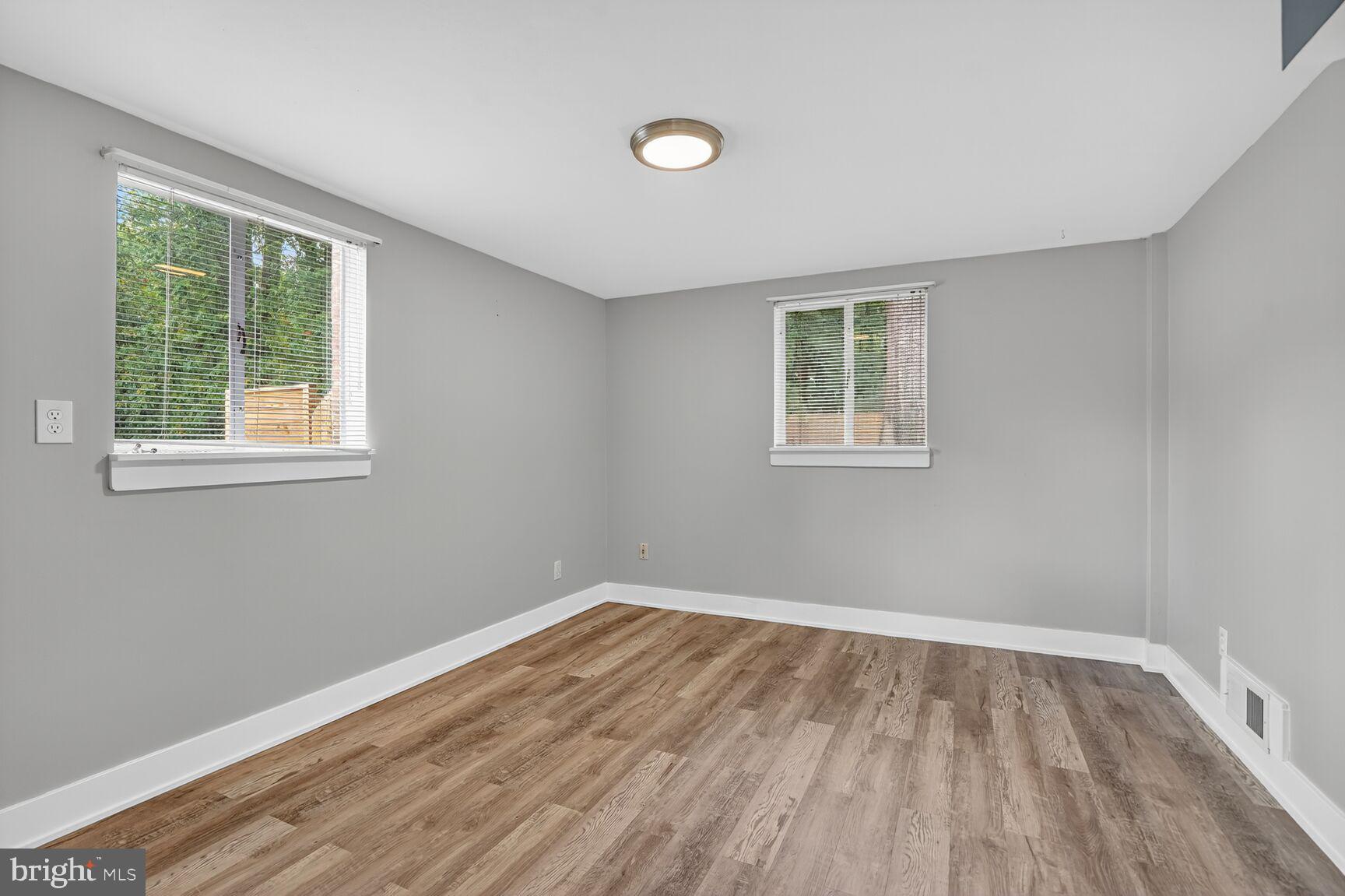 7319 Leesville Boulevard Springfield, VA 22151 - Photo 14 of 18 a view of empty room with wooden floor and fan