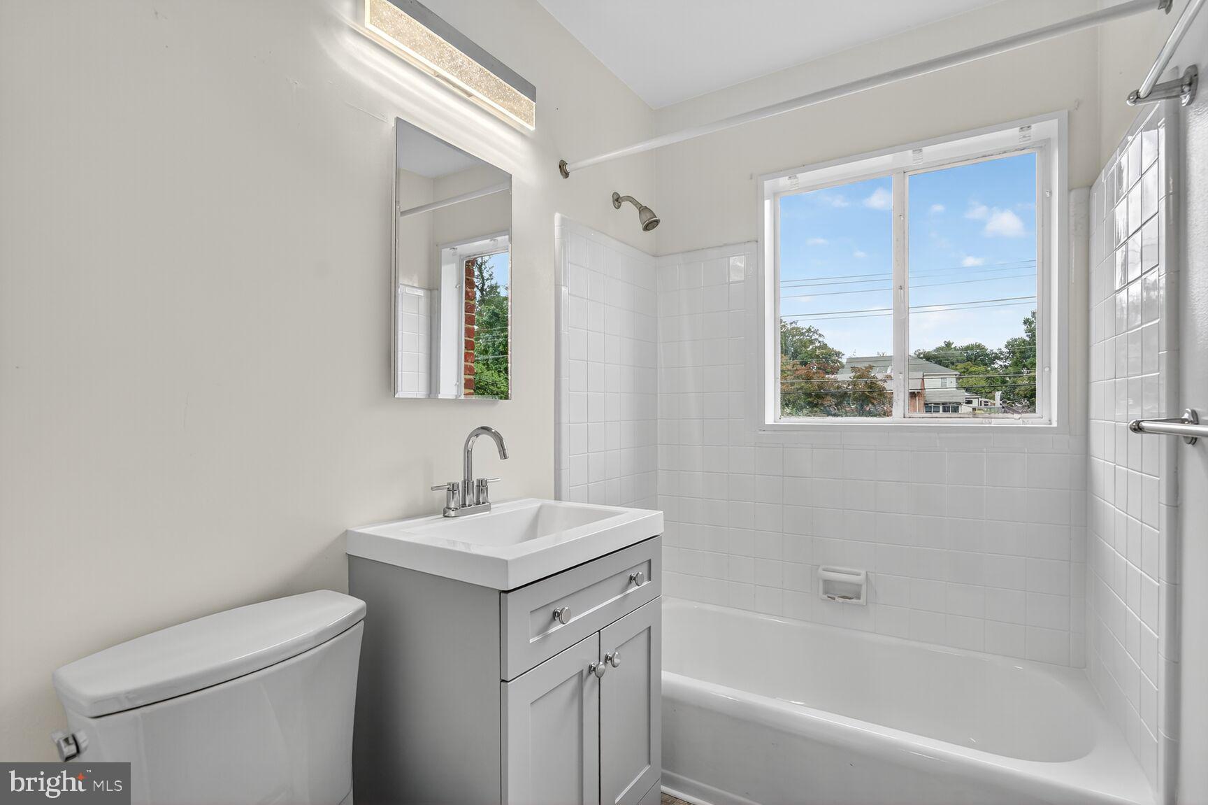 7319 Leesville Boulevard Springfield, VA 22151 - Photo 17 of 18 a bathroom with a sink toilet and shower