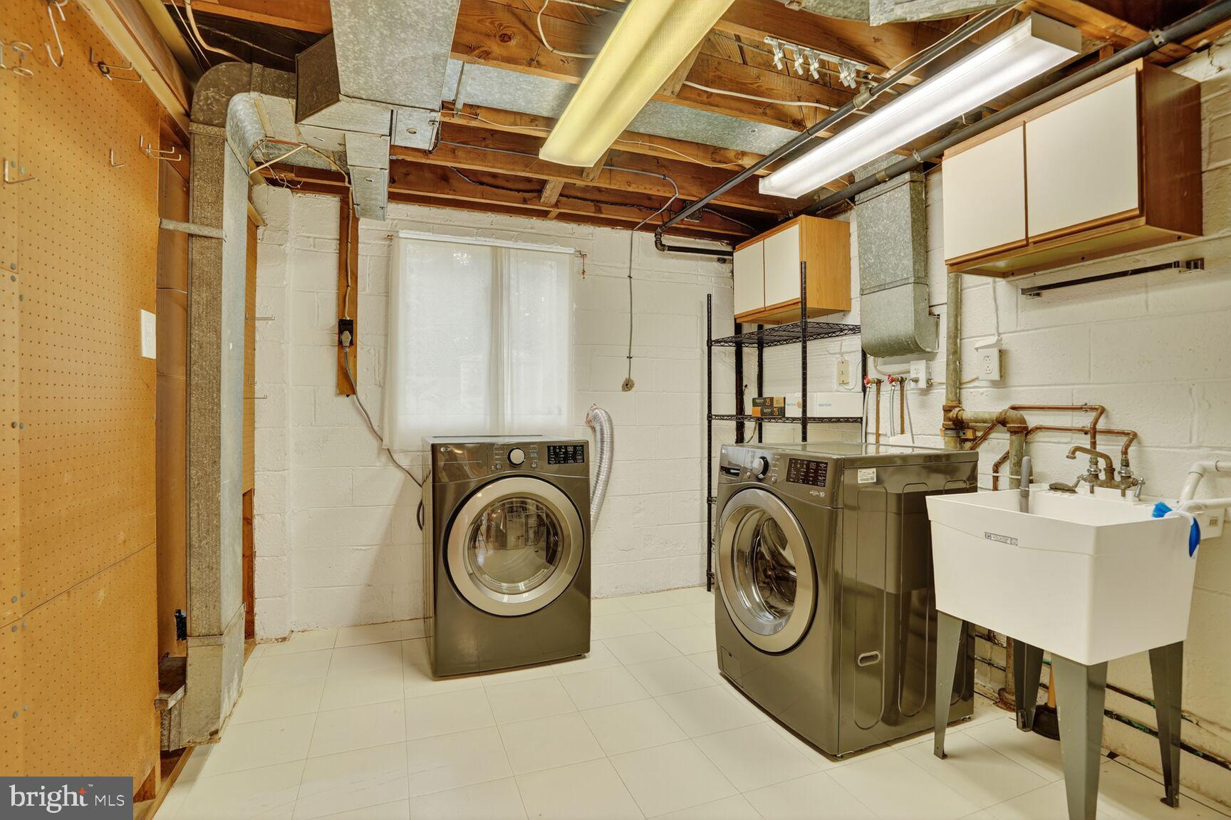 7319 Leesville Boulevard Springfield, VA 22151 - Photo 18 of 18 a utility room with dryer and washer