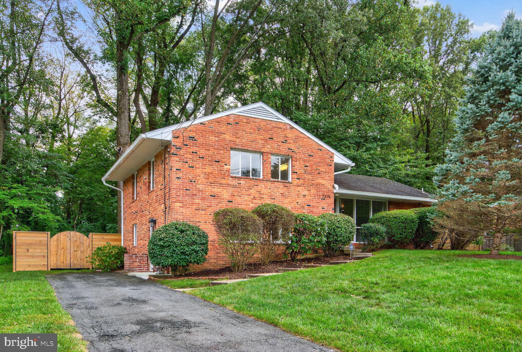7319 Leesville Boulevard Springfield, VA 22151 - Photo 2 of 18 a view of a house with backyard and garden