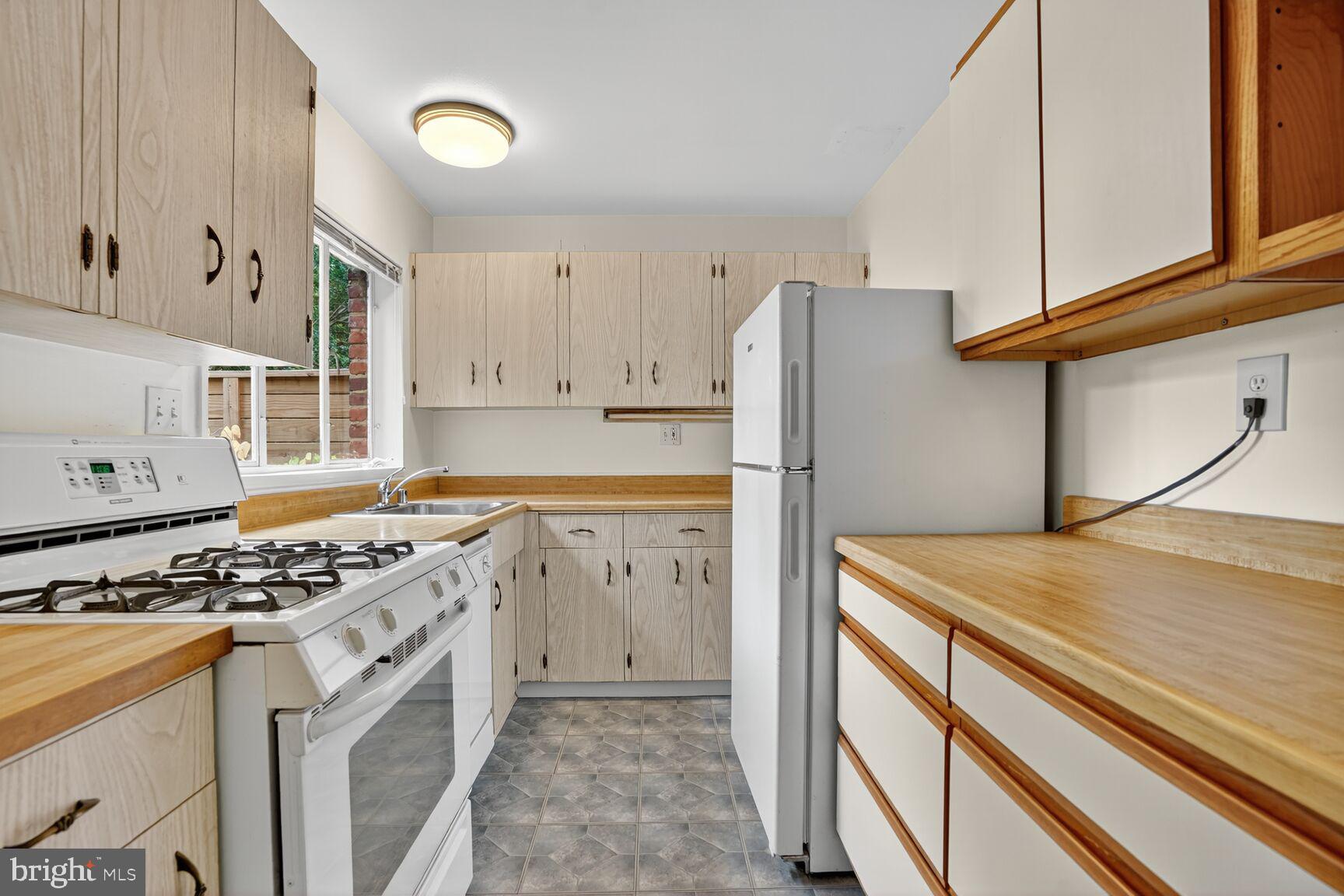7319 Leesville Boulevard Springfield, VA 22151 - Photo 8 of 18 a kitchen with granite countertop cabinets and steel stainless steel appliances