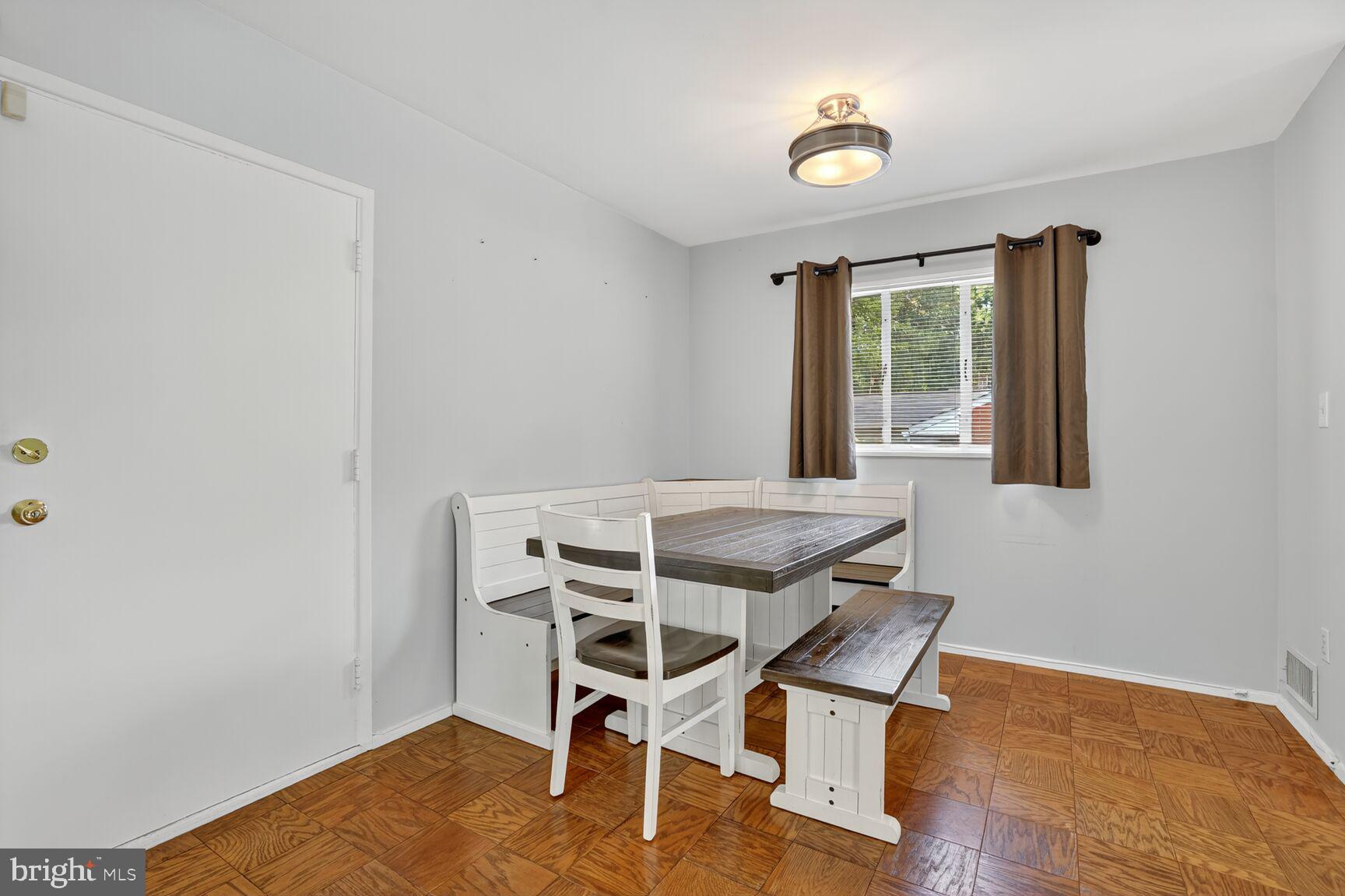 7319 Leesville Boulevard Springfield, VA 22151 - Photo 9 of 18 a dining room with furniture and wooden floor