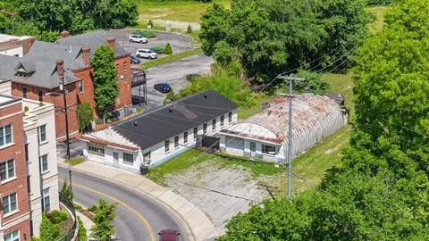 an aerial view of a house with a garden