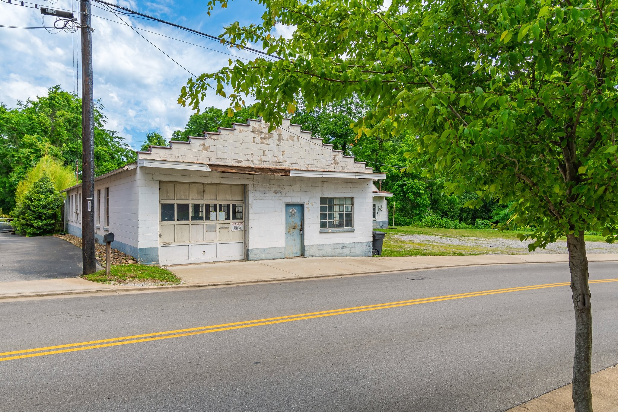 106 Bridge Street Franklin, TN 37064 - Photo 9 of 16 a view of house with outdoor space and trees in the background