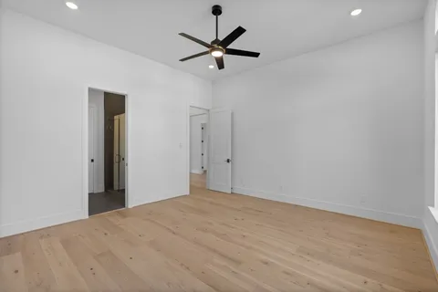 a view of an empty room with staircase