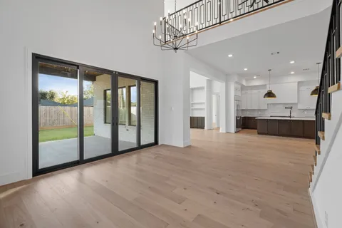 a kitchen with kitchen island stainless steel appliances a sink a center island a stove and a window