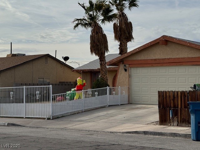 3631 Briarcliff Road Las Vegas, NV 89115 - Photo 14 of 15 Ranch-style house with stucco siding, driveway, and a garage