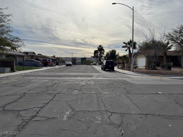 3631 Briarcliff Road Las Vegas, NV 89115 - Photo 4 of 15 View of asphalt street featuring sidewalks, curbs, and a residential view