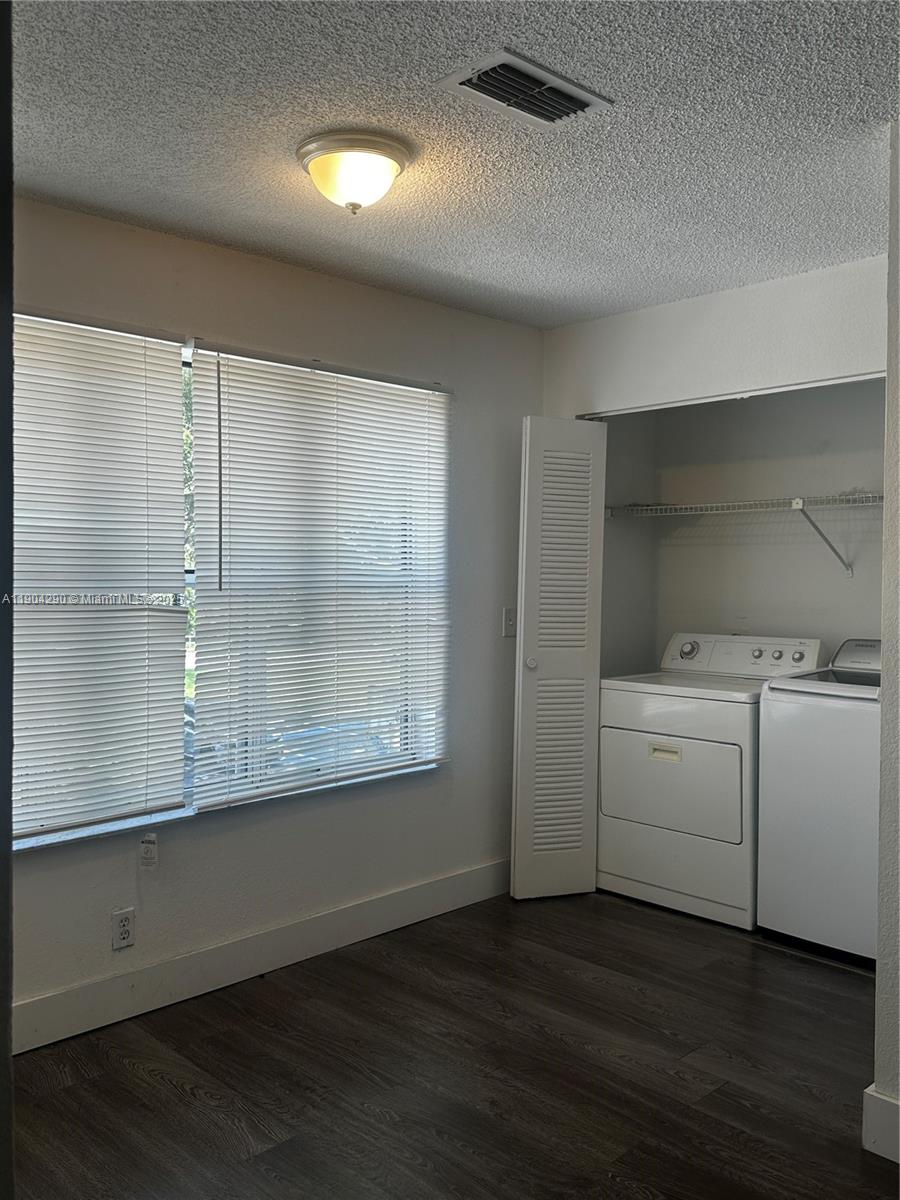 3360 Pinewalk Drive North, Unit 1325 Margate, FL 33063 - Photo 16 of 16 an empty room with wooden floor and windows