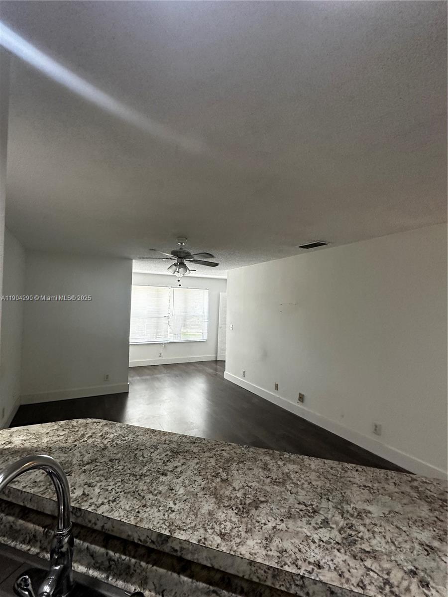 3360 Pinewalk Drive North, Unit 1325 Margate, FL 33063 - Photo 3 of 16 a view of a livingroom with wooden floor