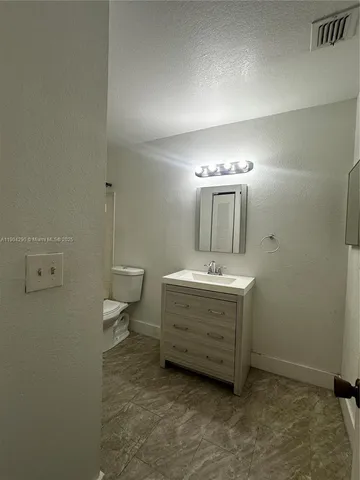 a bathroom with a sink double vanity and a mirror
