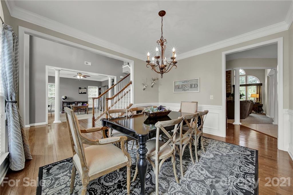 635 Panthers Way Fort Mill, SC 29708 - Photo 11 of 47 a view of a dining room with furniture and wooden floor
