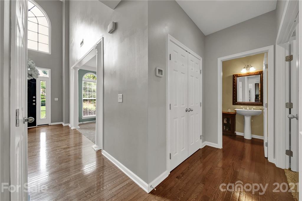 635 Panthers Way Fort Mill, SC 29708 - Photo 12 of 47 a view of a hallway with wooden floor windows and a bathroom