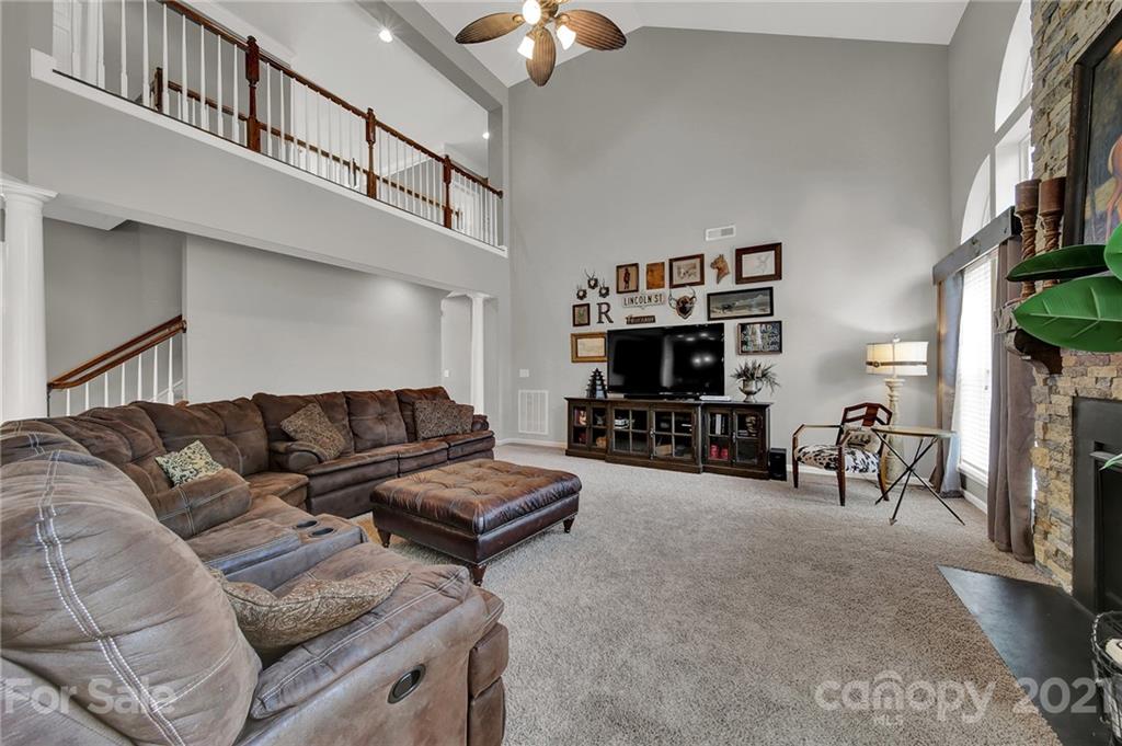 635 Panthers Way Fort Mill, SC 29708 - Photo 15 of 47 a living room with furniture and a flat screen tv