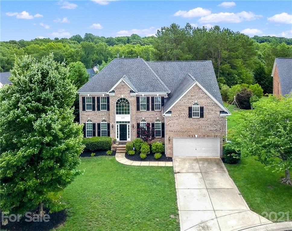 635 Panthers Way Fort Mill, SC 29708 - Photo 3 of 47 a front view of a house with a garden and plants