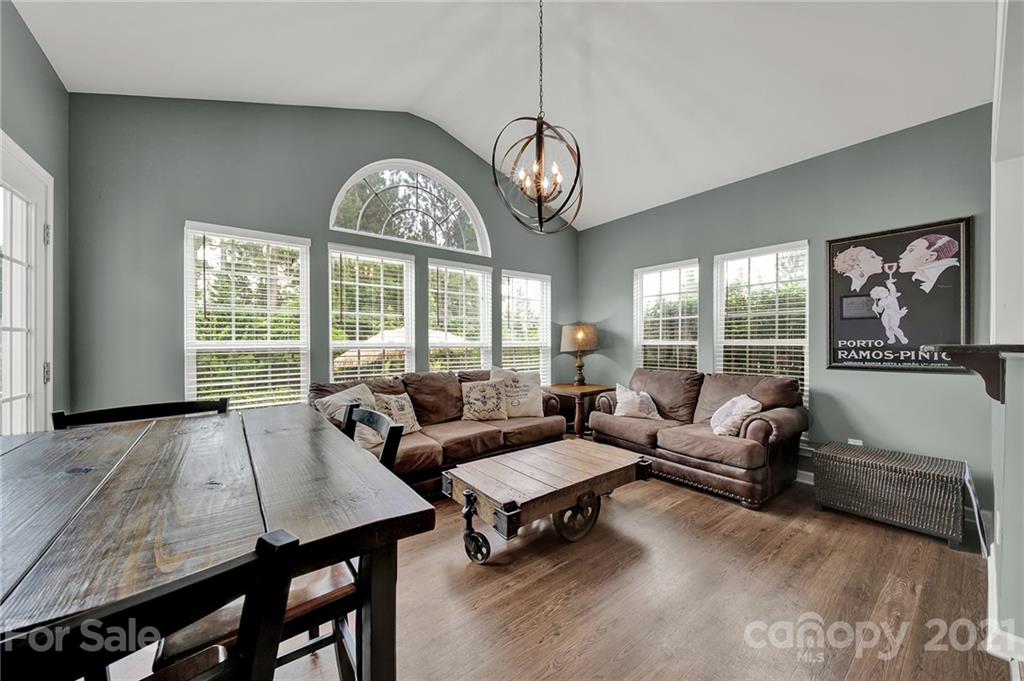 635 Panthers Way Fort Mill, SC 29708 - Photo 21 of 47 a living room with furniture chandelier and a large window