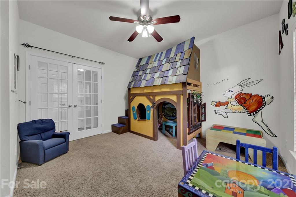 635 Panthers Way Fort Mill, SC 29708 - Photo 25 of 47 a living room with furniture and a baby crib