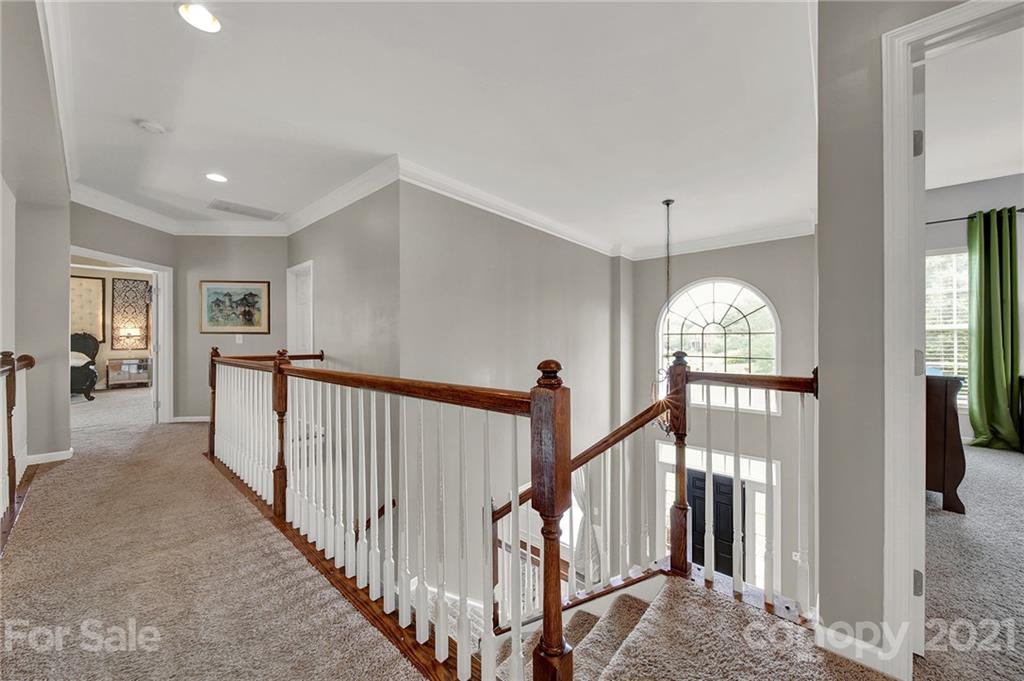 635 Panthers Way Fort Mill, SC 29708 - Photo 28 of 47 a view of a hallway with windows and stairs