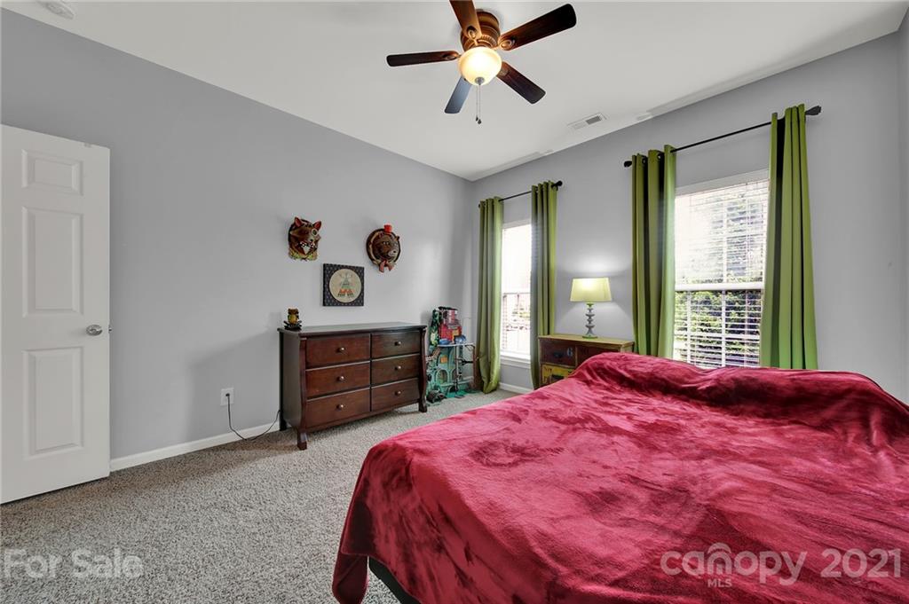 635 Panthers Way Fort Mill, SC 29708 - Photo 34 of 47 a bedroom with a bed and a dresser