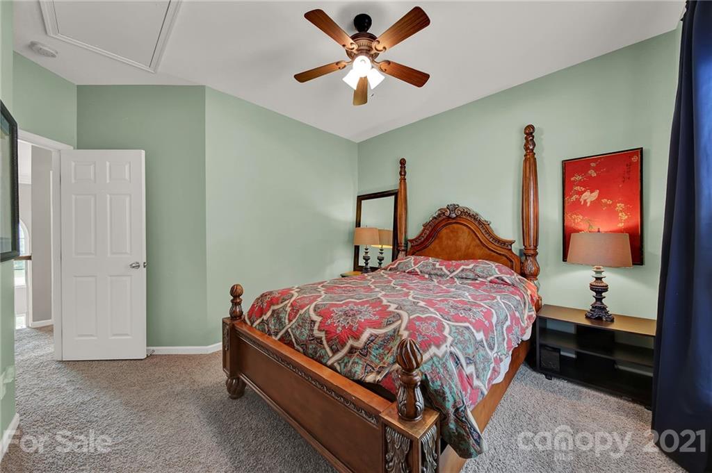 635 Panthers Way Fort Mill, SC 29708 - Photo 37 of 47 a bedroom with a bed and a painting on the wall