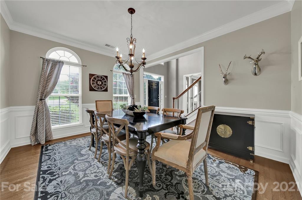 635 Panthers Way Fort Mill, SC 29708 - Photo 9 of 47 a view of a dining room with furniture and wooden floor