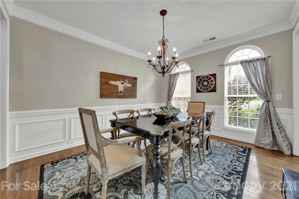 635 Panthers Way Fort Mill, SC 29708 - Photo 10 of 47 a view of a dining room with furniture and a chandelier