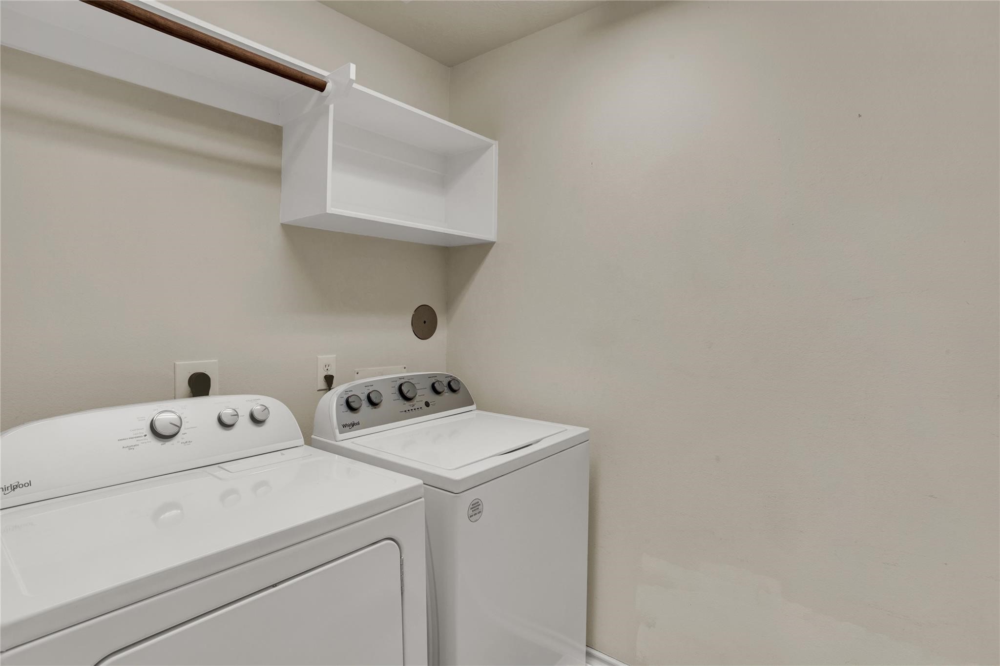 326 Brandy Ridge Lane Dickinson, TX 77539 - Photo 21 of 22 a view of storage and utility room with washer and dryer