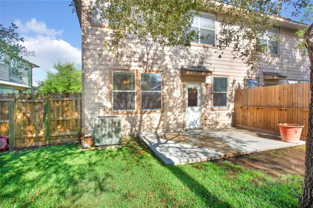 a view of yard with patio