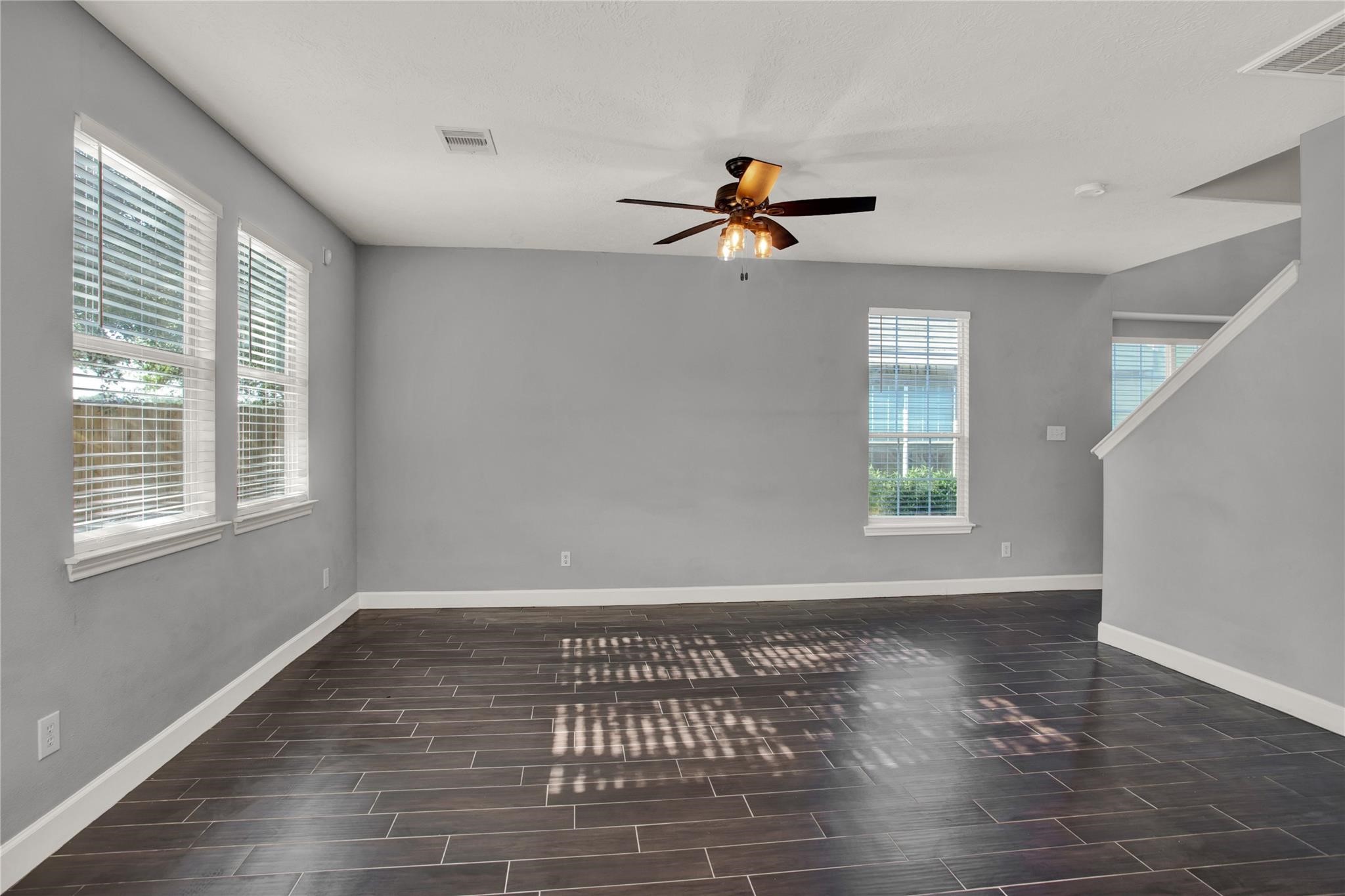 326 Brandy Ridge Lane Dickinson, TX 77539 - Photo 5 of 22 a view of empty room with wooden floor and fan