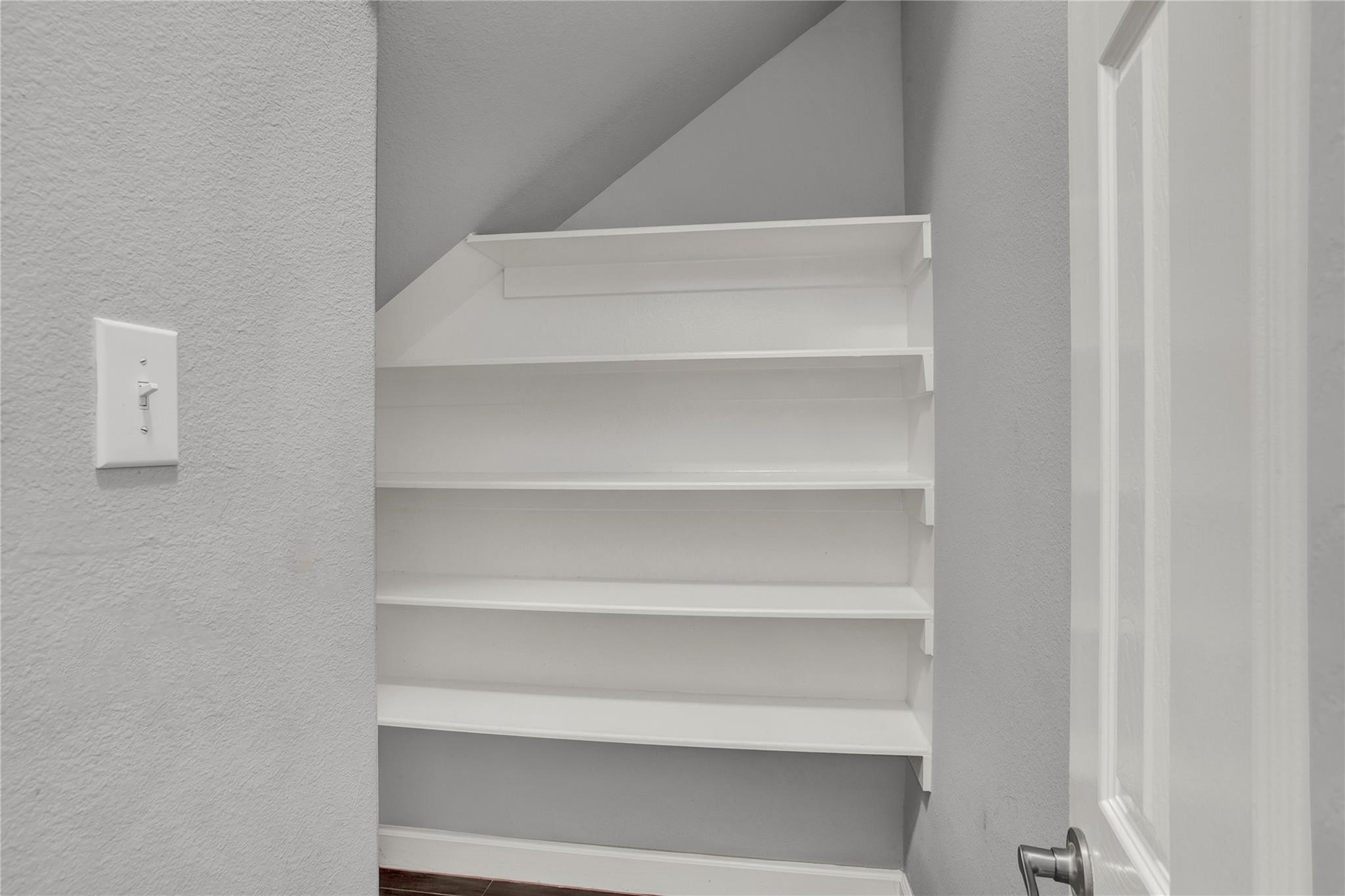 326 Brandy Ridge Lane Dickinson, TX 77539 - Photo 9 of 22 a view of walk in closet with empty racks