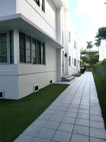 a view of a backyard of the house