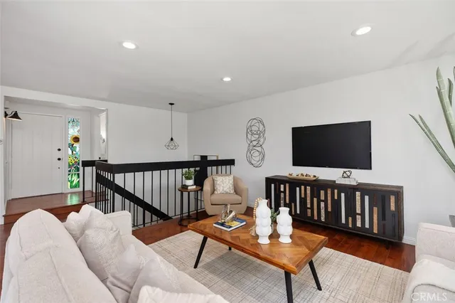 a kitchen with a stove a sink and a microwave