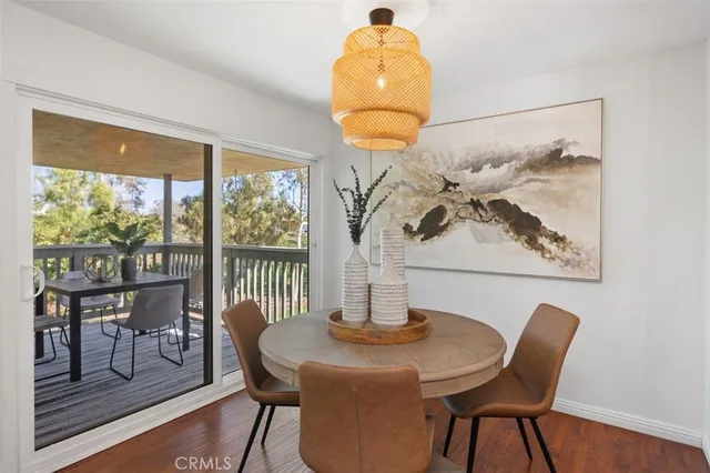 a view of a two chairs in the balcony