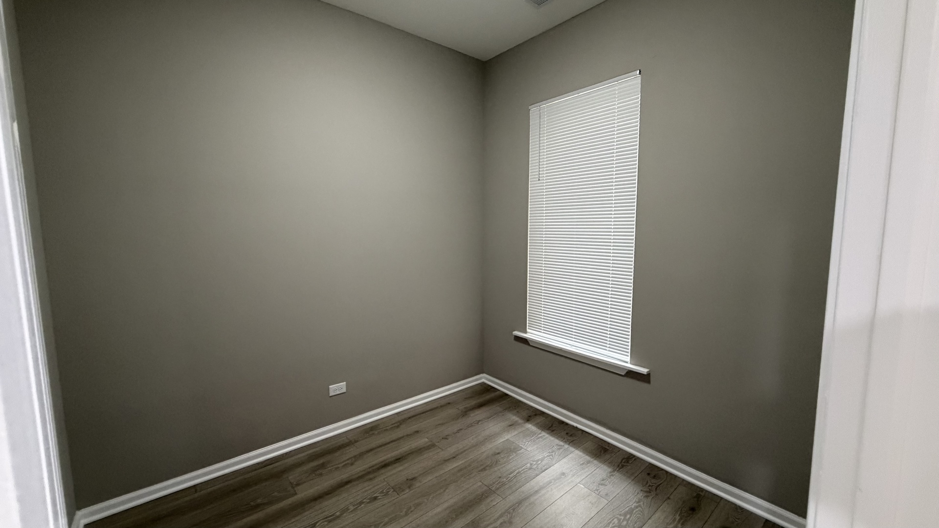 5344 South Aberdeen Street, Unit 1 Chicago, IL 60609 - Photo 12 of 17 a view of a small space with wooden floor and a window