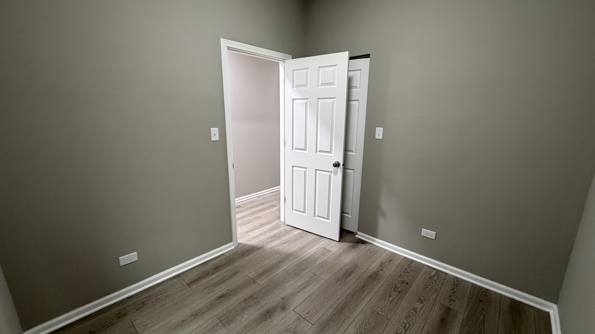 5344 South Aberdeen Street, Unit 1 Chicago, IL 60609 - Photo 13 of 17 an empty room with wooden floor and entrance