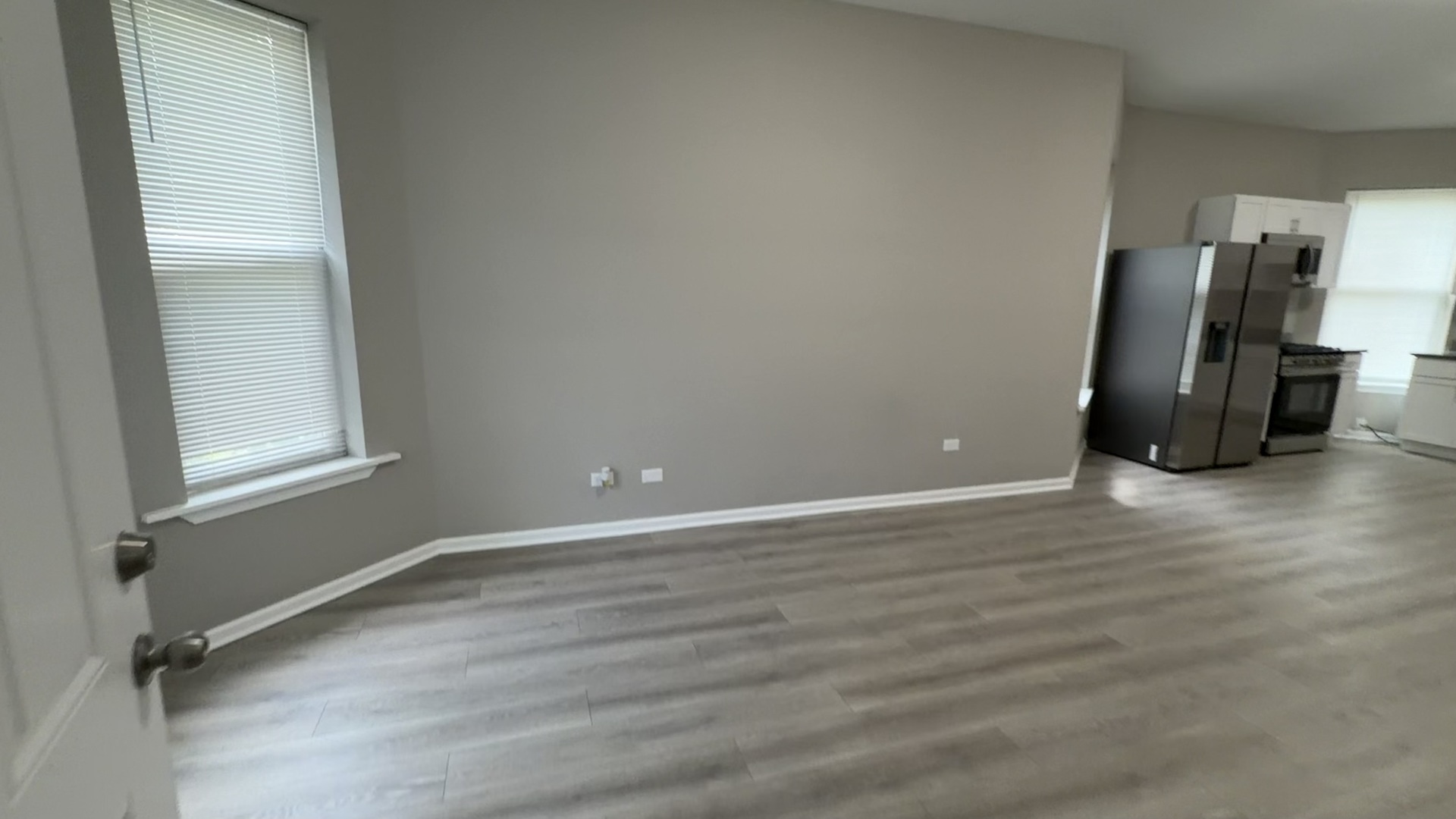 5344 South Aberdeen Street, Unit 1 Chicago, IL 60609 - Photo 2 of 17 a view of a livingroom with wooden floor and a window