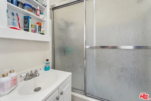 a bathroom with a sink and a shower